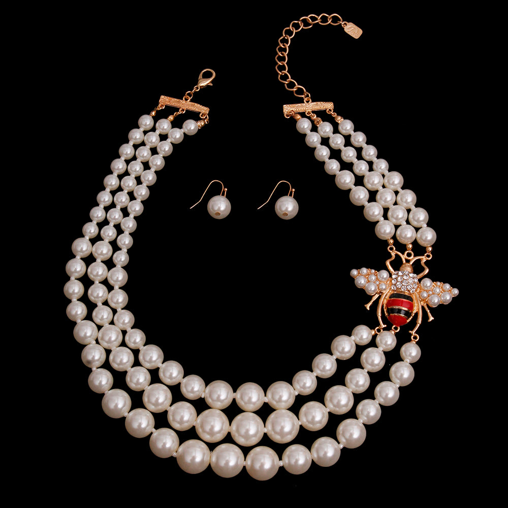 Designer Style Cream Pearls and Striped Gold Bee Layered Necklace Set